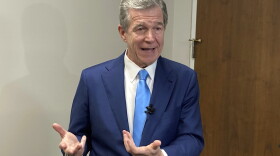 North Carolina Gov. Roy Cooper speaks with reporters after the Council of State meeting at the Department of Transportation headquarters in Raleigh, N.C., Tuesday, Aug. 1, 2023. Cooper said he's not convinced that details within a tax-cut agreement reached between Senate leader Phil Berger and House Speaker Tim Moore will protect the state from revenue shortfalls, (AP Photo/Gary D. Robertson)