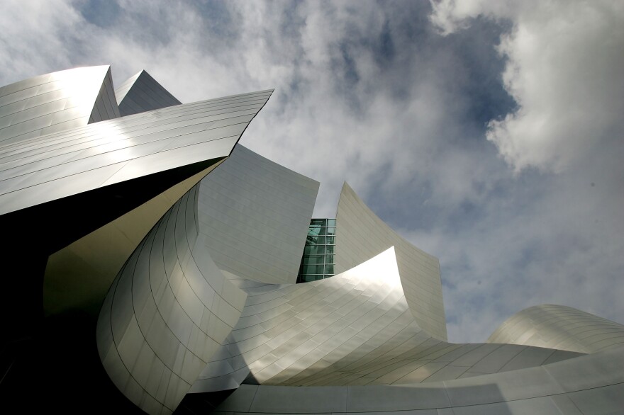 Light reflects off the shimmering stainless steel panels on Gehry's Walt Disney Concert Hall in Los Angeles.