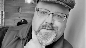 A black and white image of IT Manager Joshua Kraling