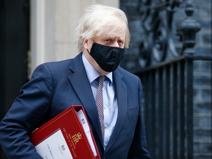 A mask-clad U.K. Prime Minister Boris Johnson departs from number 10 Downing Street in London in March.