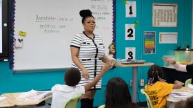 Third grade teacher Alexis McCane coaches students through a reading passage at Tulsa Public School's Anderson Elementary.