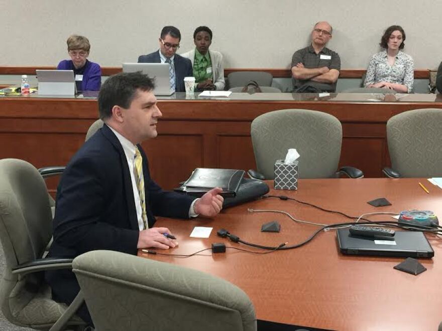 State Senator Patrick Colbeck sitting at a table