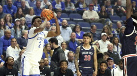 Kentucky's Jaxson Robinson (2) prepares to shoot a 3-point basket while guarded by Jackson State's Dorian McMillian, right, during the first half of an NCAA college basketball game in Lexington, Ky., Friday, Nov. 22, 2024. (AP Photo/James Crisp)
