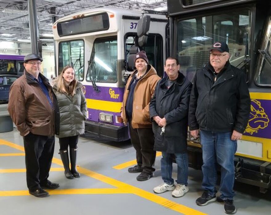 From left to right: Peter Hannen, MCPT Assistant Director; Miranda Lambert, MCPT Transit Director; Tom Schwartz, Midwest Bus Museum President; Jeff Waxman, IDOT Project Manager/Midwest Bus Museum member; and Vince Allen, retired from the CTA/current Midwest Bus Museum member; posing in front of the donated buses.