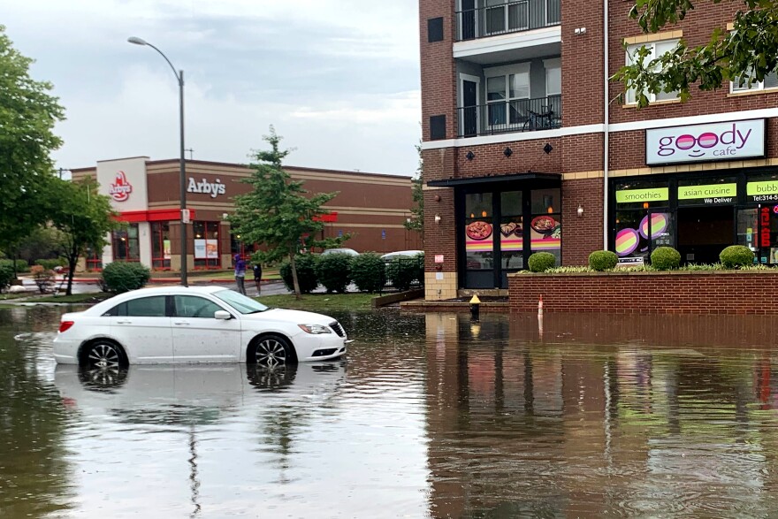 Flash floodwaters strand cars on Lindell Boulevard near Vandeventer Avenue. in the Central West End neighborhood of St. Louis.