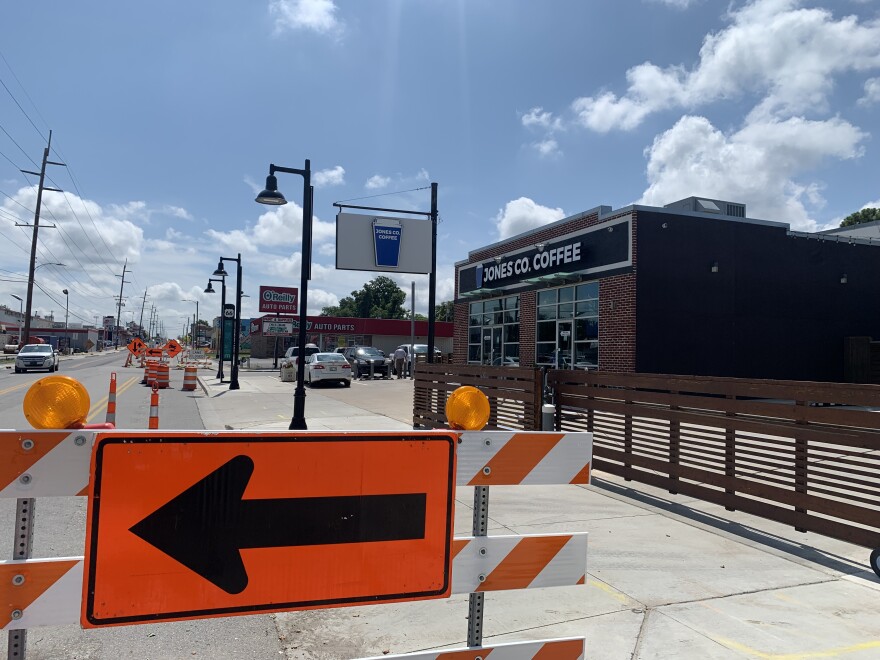 Construction signs and cones are seen outside Jones Co. Coffee.