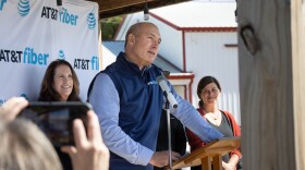AT&T CEO John Stankey addresses the media and visitors to the event Wednesday at Farm 57 in Evansville. The event is celebrating the first 2,000 rural fiber access points coming online. Behind him on stage is Vanderburgh County Commissioner Cheryl Musgrave, who is instrumental in the project. On the right is Stephanie Peckenpaugh, co-owner of Farm 57, one of the first fiber internet customers.