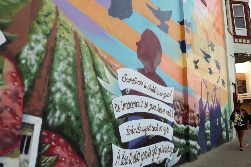 One of Joel Aguilar’s first murals is on the corner of Main Street. It was done for the restaurant’s owner in honor of a child who died.