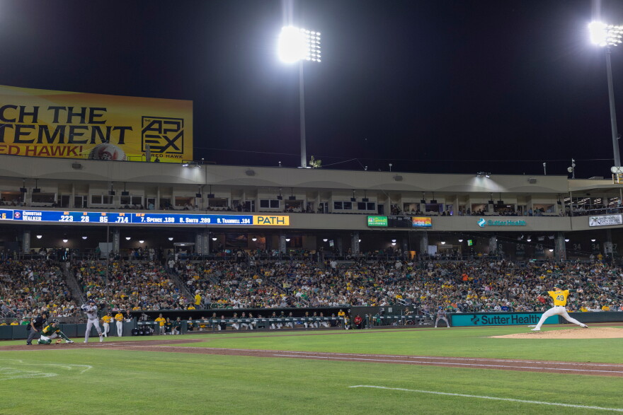 Houston Astros' Christian Walker, third from left, takes an at-bat and hits a double during the sixth inning of a baseball game against the Athletics, Saturday, Sept. 26, 2026, in West Sacramento, Calif. (AP Photo/Sara Nevis)