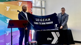 Gene Willis (left), the corporate social responsibility manager at the Government Employees Health Association, with YMCA of Greater Oklahoma City Vice President and COO Mike Roark.