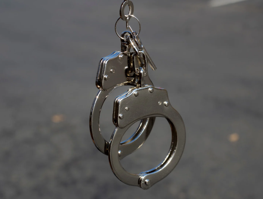 This photo shows a pair of police handcuffs.