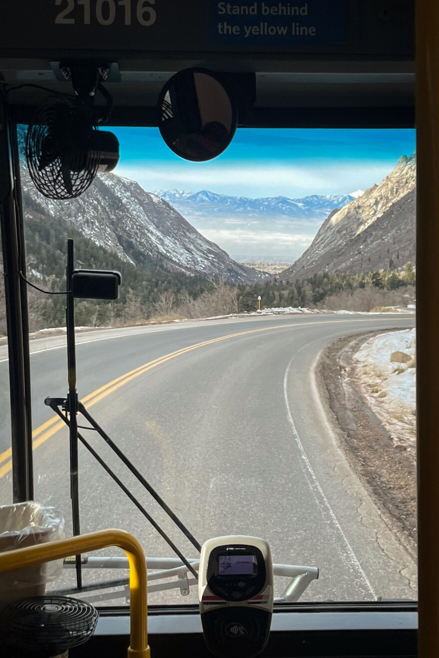 The inversion easily is visible through the windshiled while the UTA ski bus descends back into the Salt Lake Valley from Little Cottonwood Canyon, Dec. 18, 2023