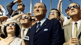 Vice President Spiro Agnew (right) and former President Lyndon Johnson view the liftoff of Apollo 11 from the stands at the Kennedy Space Center on July 16, 1969.
