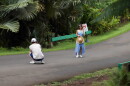 Two people take a photo in the road at Hoʻomaluhia. The park has a strict policy against standing on the main road and staff have said they've warned visitors.