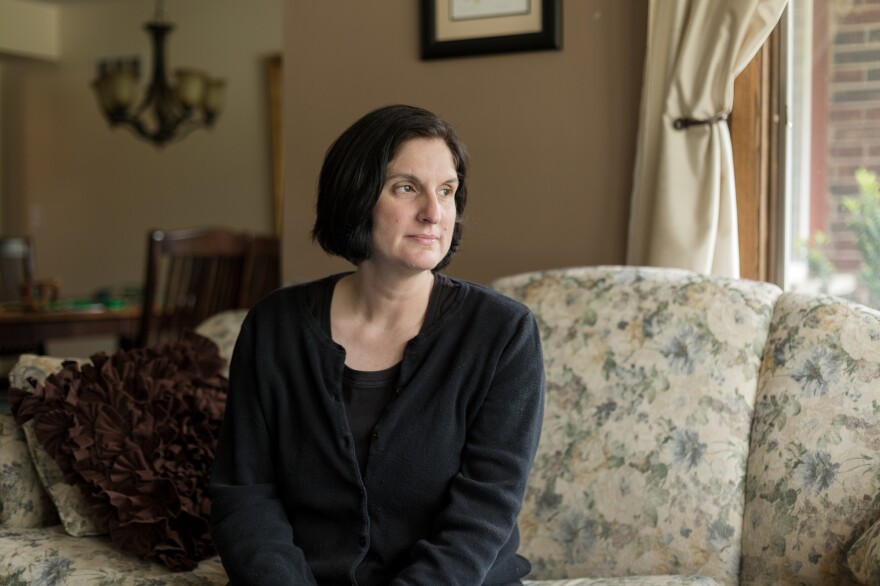 Nancy Gapinski waits for the school bus to drop off her 10-year-old son, Ben, at their home in Glendale, Wis.