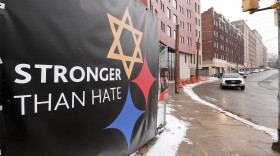A "Stronger Than Hate" sign on a fence in Pittsburgh's Squirrel Hill neighborhood. Eleven people were killed and seven more wounded during an attack in the neighborhood's Tree of Life Synagogue last October.