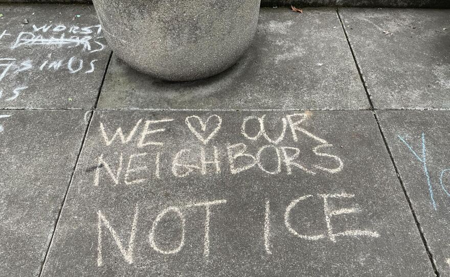 Chalk messages on the sidewalk outside the Eugene federal building on Friday, Jan. 30, 2026.