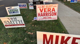 Campaign signs line the route to an early voting center in Saginaw, Michigan