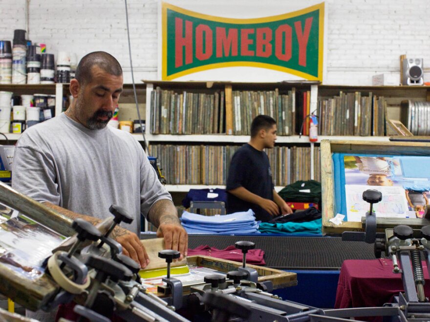Workers print T-shirts at the Homeboy Industries shop in Los Angeles. A $5 million budget shortfall threatens the organization.