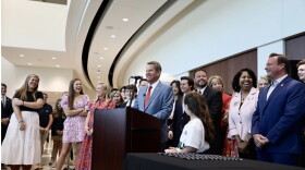 Gov. Kemp speaking at the Forsyth County Arts and Learning Center before signing 7 education related bills.