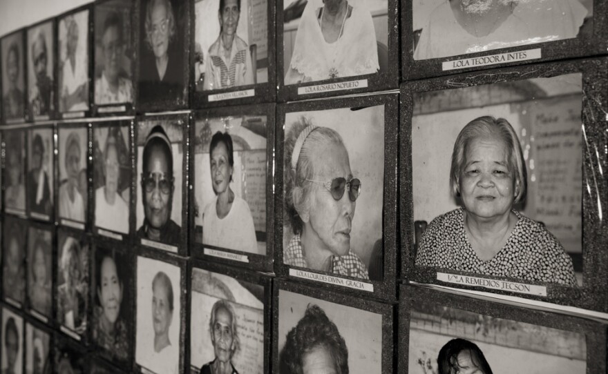 Images of the estimated 1,000 Philippine "comfort women" who were enslaved and sexually victimized by the Japanese Imperial Army during World War II fill a wall at the offices of Lila Pilipina. The organization of World War II victims of sexual war crimes has helped the "comfort women" in their fight for compensation.