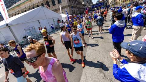 Boston Marathon runners after crossing the finish line in the 129th race in 2025. (Jesse Costa/WBUR)