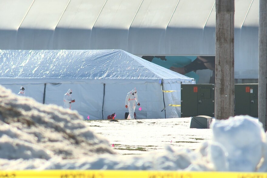 Workers heading into a Rose Acres egg layer facility after an avian influenza outbreak.