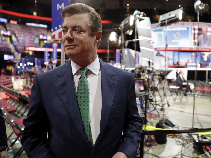 Paul Manafort talks to reporters on the floor of last summer's Republican National Convention in Cleveland.