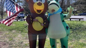 Chris Vacher and Bobby Whitescarver greeted the parade as it arrived at Gypsy Hill Park in Staunton, dressed in inflatable bear and frog costumes. In solidarity with the Portland protestors, they said that they're standing up for democracy, truth, and the rule of law in a silly, non-threatening way.