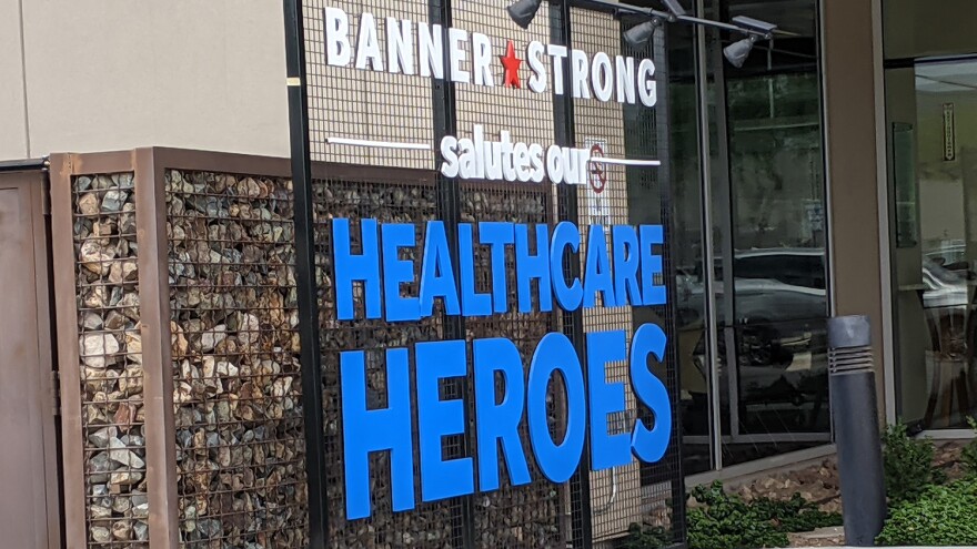 A sign honoring health care workers outside Banner Estrella Medical Center