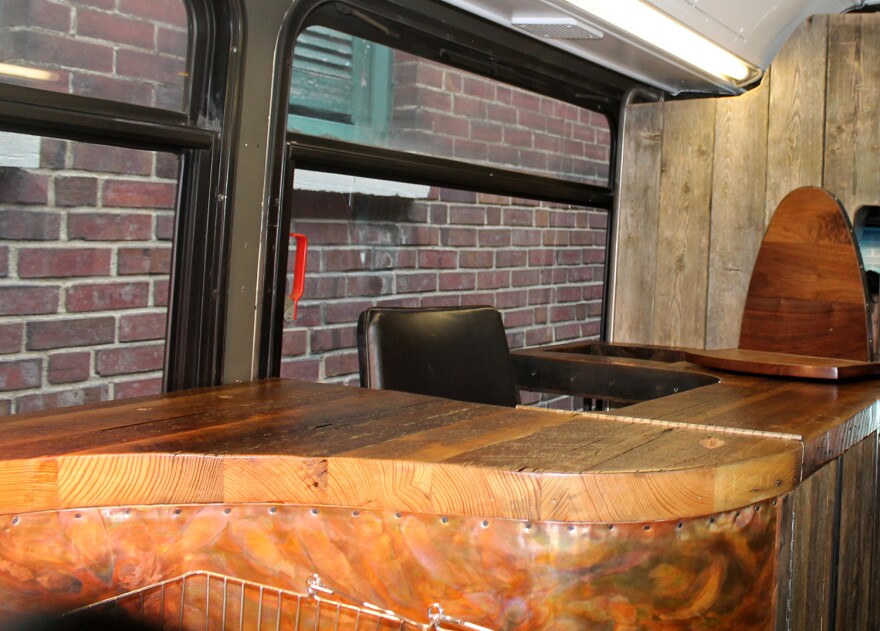 Copper and wood detail at the checkout counter designed by David Stavron of Shellback Ironworks.