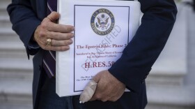 Rep. Thomas Massie (R-Ky.) holds a copy of a bill he cosponsored with Rep. Ro Khanna (D-Calif.) to force the House to vote on the complete release of the government's files on Jeffrey Epstein as he speaks with reporters outside the U.S. Capitol July 21, 2025.
