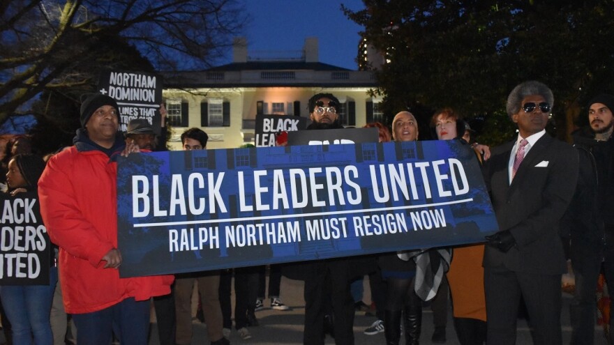 Protesters stand outside Virginia's Executive Mansion in February.