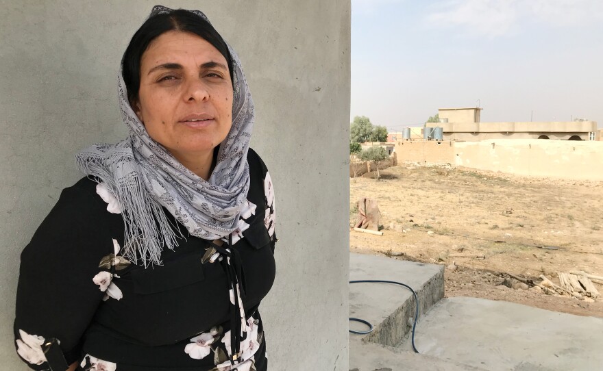 Kamo Zandinan in a village in the Sinjar region of northern Iraq. Zandinan returned to Sinjar in October. She is undergoing DNA tests conducted by investigators trying to confirm the identity of ISIS victims thrown into mass graves. Zandinan believes her husband and eldest son are among them.