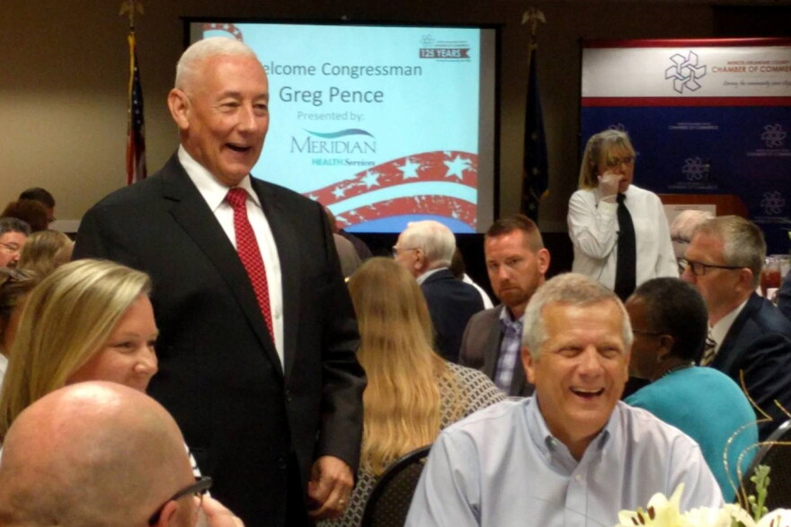 U.S. Rep. Greg Pence (R-6th District), standing, talks with constituents at a Chamber of Commerce lunch in Muncie in August 2019