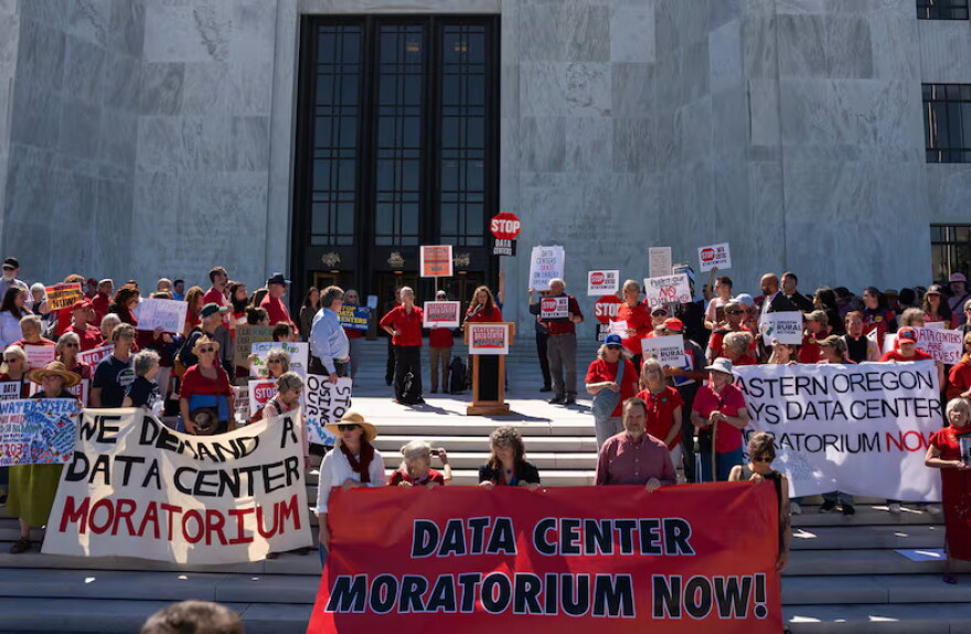 People gather in front of the Oregon State Capitol, advocating for a statewide data center moratorium, in Salem, Ore., Sept. 8, 2026.