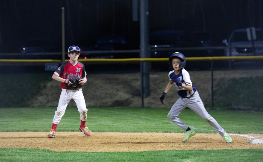 Abington Little League played under new lights for the first time on Monday.