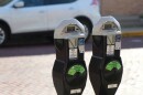 a close up of two City of Columbia parking meters. 