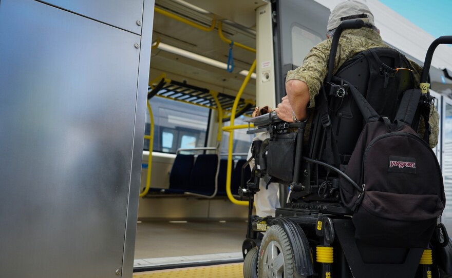 Waikīkī resident Kirby Shaw tours a Honolulu rail car on June 2, 2023.