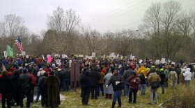 Protesters gather outside the gated community where Governor Snyder lives.