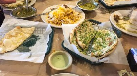Chef Kaiser Lashkari greeted NPR to his restaurant, Himalaya, with a spread including garlic naan, butter naan and saag paneer. His restaurant has become an institution in multi-ethnic Houston.