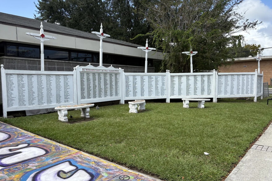 A “Wall of Compassion” in Jacksonville lists the names of people, including scores of children, killed by gun violence in the city.