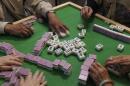 Clients play mahjong at adult daycare Hong Fook Center on Tuesday, Sept. 24, 2024, in Oakland, Calif. (Juliana Yamada/AP)