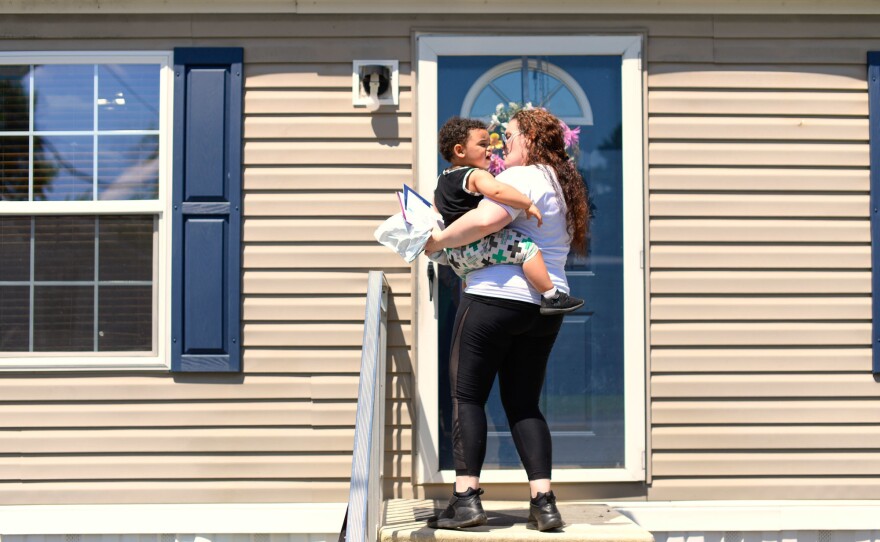Kelly Zimmerman holds her son, Jaxton, outside their home in Douglassville, Pa. Kelly moved in with her parents before Jaxton's birth; the baby's father died in July of 2016 from a heart attack.