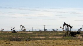 FILE - Oil rigs stand in the Loco Hills field on April 9, 2014, on in Eddy County near Artesia, N.M.. The state's environmental regulators have proposed a new regulatory framework for reusing wastewater with a major focus on treating and repurposing the used, salty byproducts of oil and natural gas drilling in a major U.S. petroleum production zone. The EPA announced Thursday, Dec. 28, 2023, its petition to the state Water Quality Control Commission to begin formal deliberations on the proposed rules.