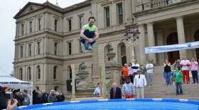 Lt. Gov. Brian Calley takes the polar plunge yesterday outside the Capitol building to raise money for Special Olympics Michigan