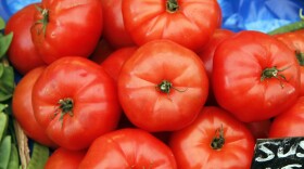Tomatoes on a market table.
