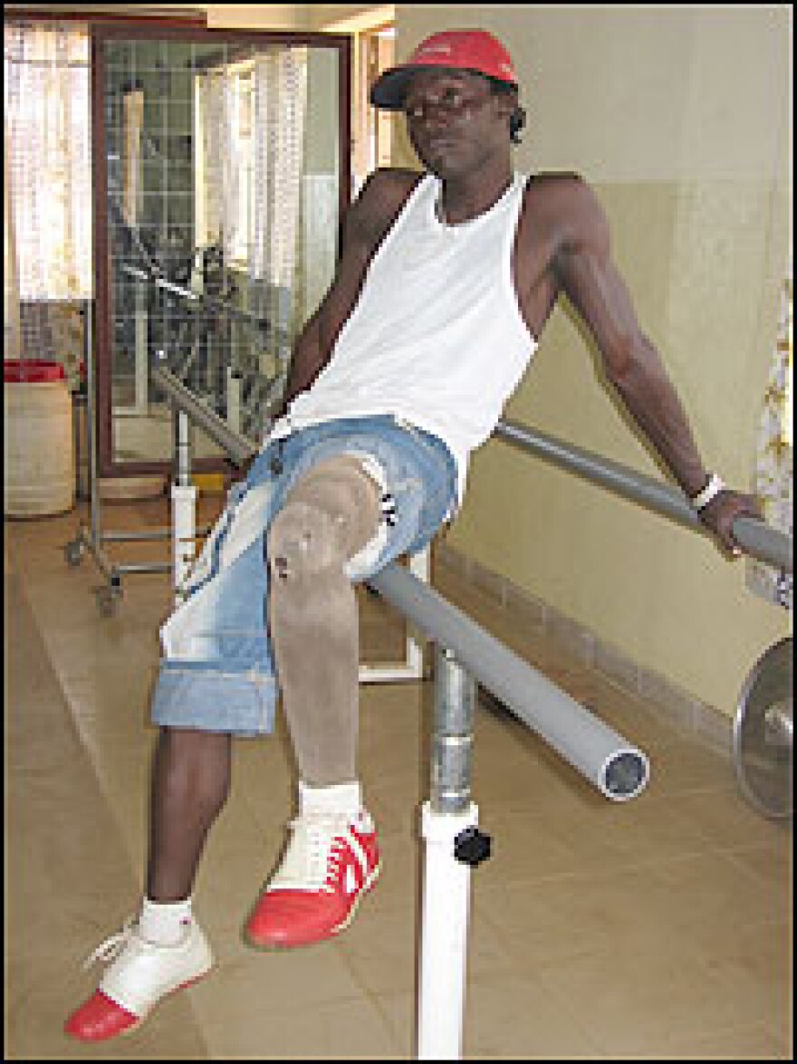 Maxwell Fornah, now 23, was shot by rebels during Sierra Leone's civil war, and his leg was amputated. "Let him stay forever jailed," he says of Charles Taylor. "He caused this amputation."