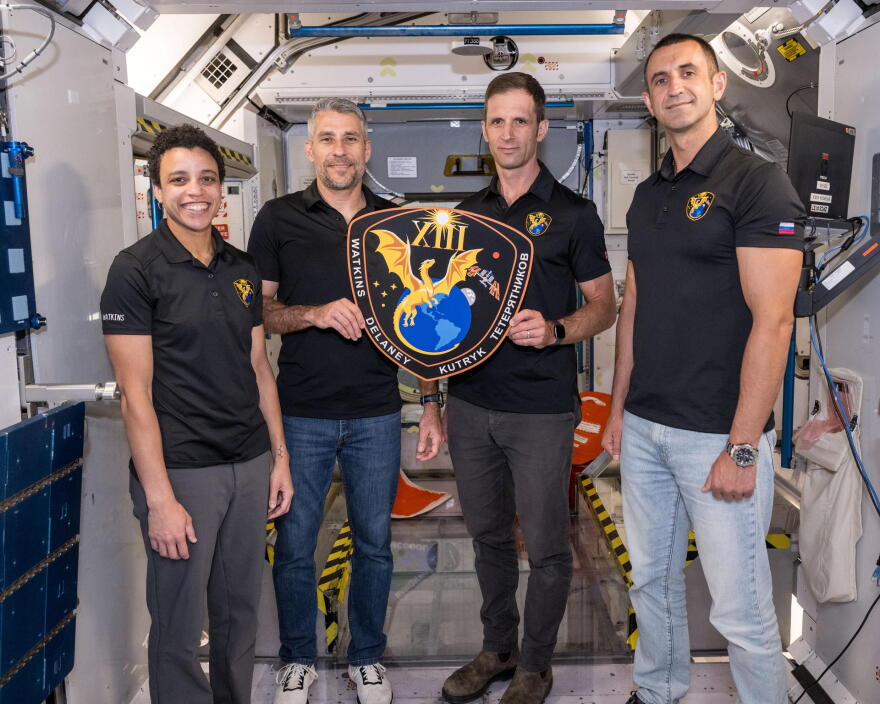 The four members of NASA’s SpaceX Crew-13 mission to the International Space Station display their mission plaque inside a training mockup of a space station module. From left are, Commander Jessica Watkins and Pilot Luke Delaney, both from NASA, and Mission Specialists Joshua Kutryk of CSA (Canadian Space Agency) and Sergey Teteryatnikov of Roscosmos.