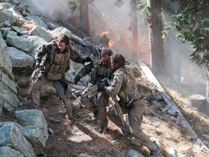 In <em>Lone Survivor</em>, Mark Wahlberg (left) stars as former Navy SEAL Marcus Luttrell, who was the lone survivor of a mission in Afghanistan in 2005.